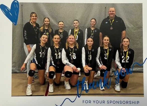 Youth volleyball team sponsored by Dan's Oilfield Rentals with their gold medals