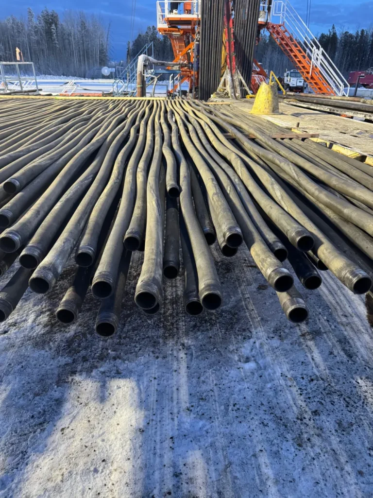 Recovered tubing laid out at a Dan's Oilfield Rentals yard