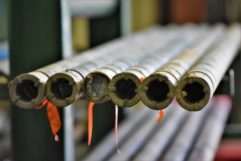 Row of heavy-walled drill collar pipe ends